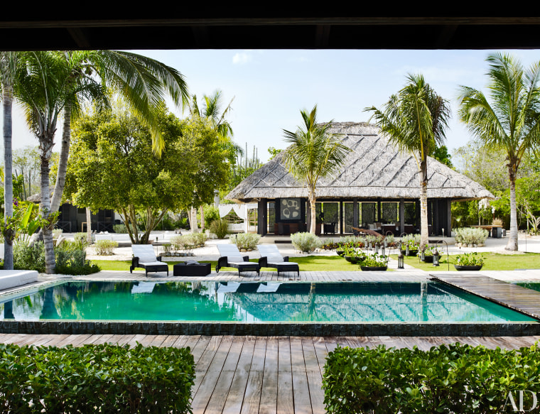 An infinity pool sits near the main house.