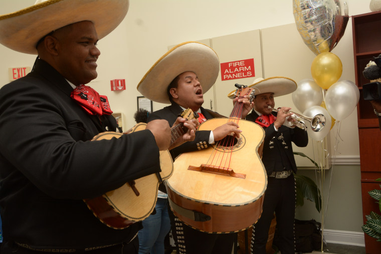 The newlyweds were surprised with a mariachi band during their reception.