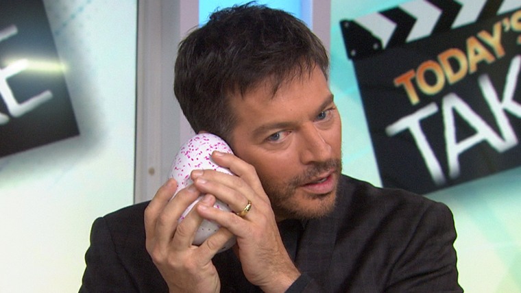 What's going on in there? Harry Connick Jr. waits for the Hatchimal egg to crack.
