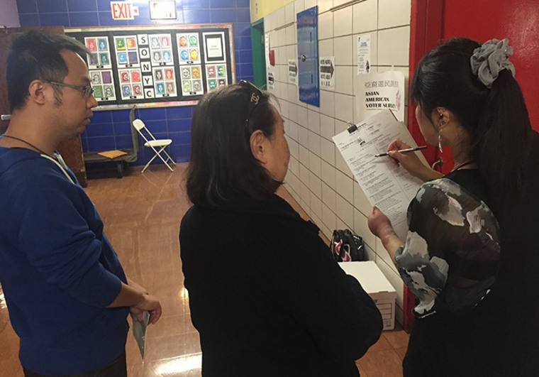 Volunteers from the Asian American Legal Defense and Education Fund conduct exit polling at PS 126 in Manhattan on April 20, 2016.