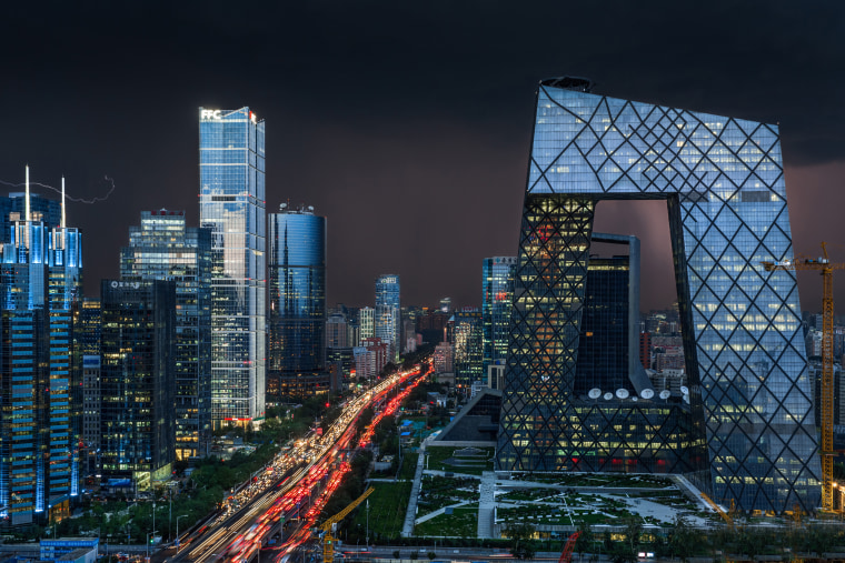 Image: The CCTV Tower, right, and other skyscrapers and high-rise office buildings in Beijing