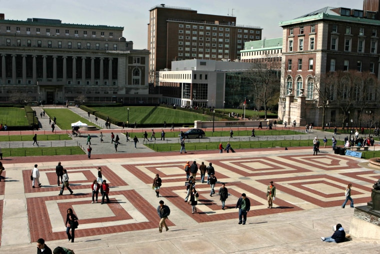 Students walk across the campus of Columbia University in Ne