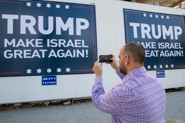 Image: "Trump Makes Israel Great Again" placard in Tel Aviv