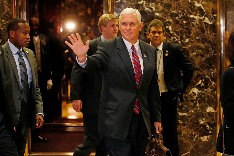 Image: Vice president-elect Mike Pence departs Donald Trump's Trump Tower in New York