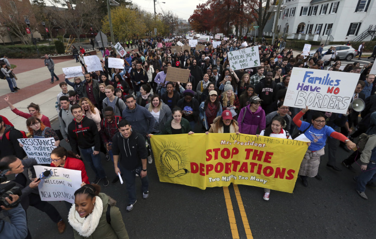 Hundreds of Rutgers University students block College Ave., in New Brunswick, N.J., as they march to protest some of President elect Donald Trump's policies and to ask school officials to denounce some of his plans at Rutgers University Wednesday, Nov. 16