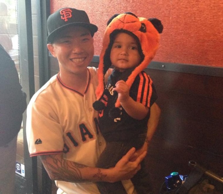 Min Matson and his son Aiden cheering for this San Francisco Giants in 2014.