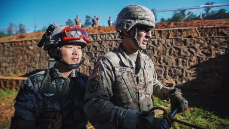 Image: A U.S. soldier and a member of the Chinese People's Liberation Army