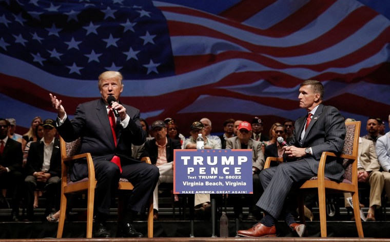 Image: Republican presidential nominee Donald Trump speaks along side retired U.S. Army Lieutenant  General Mike Flynn during a campaign town hall meeting in Virginia Beach, Virginia