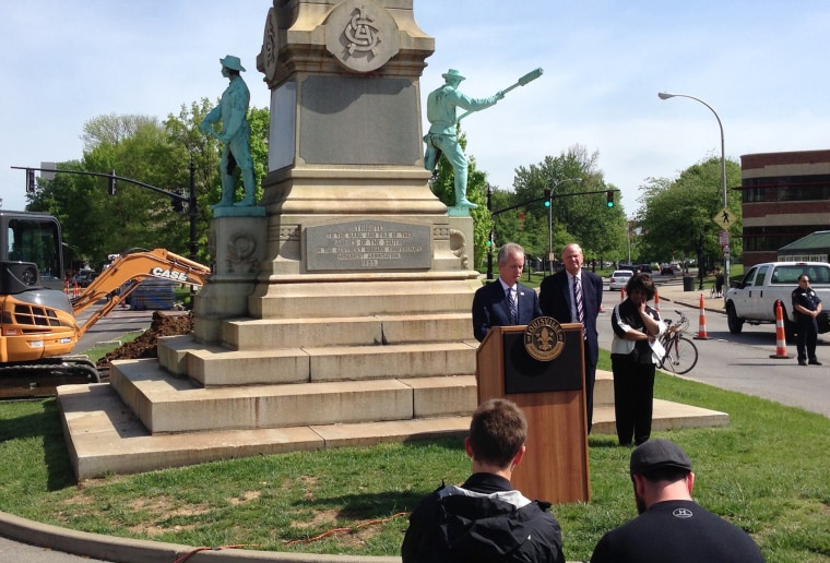 Louisville Mayor Greg Fischer speaks in front of the Confederate monument near the University of Louisville with the university president, James Ramsey, left, in Louisville, Kentucky, April 29, 2016.