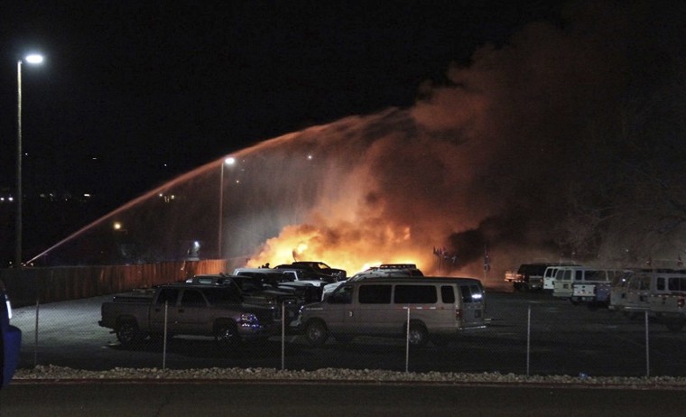 Flames rise from the wreckage of an American Medflight plane, Friday, Nov. 18, 2016, after it crashed in Elko, Nev., on Friday, Nov. 18, 2016.