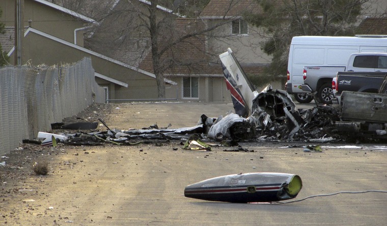 The wreckage of an American Medflight plane sits in the Barrick Gold Corp. parking lot  in Elko, Nev., Saturday, Nov. 19, 2016.