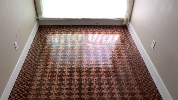 $130 worth of pennies make up this gorgeous DIY floor