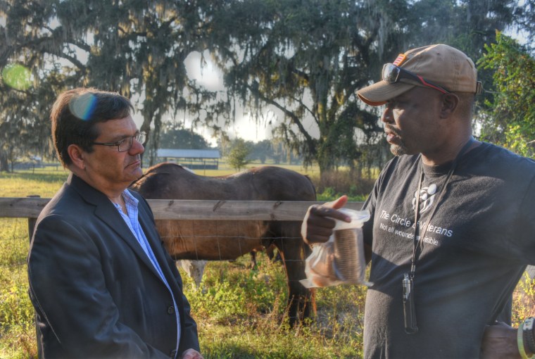 Decorated veteran Tice Ridley, right, met with Florida Rep. Gus Bilirakis, vice chairman of the Congressional Veterans Affairs Committee, at the Circle of Veterans Ranch to explain the program.
