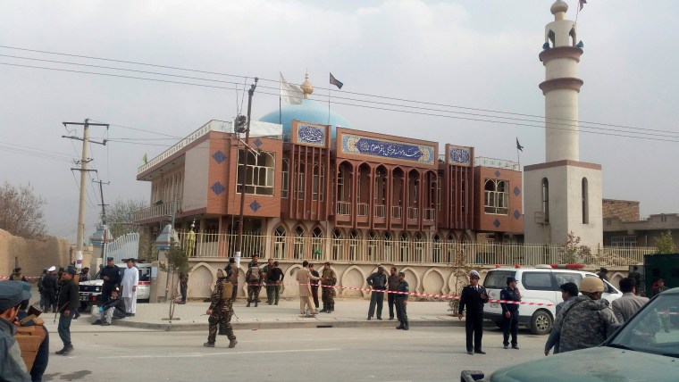 Image: Afghan security forces keep watch in front of a mosque where an explosion happened in Kabul, Afghanistan