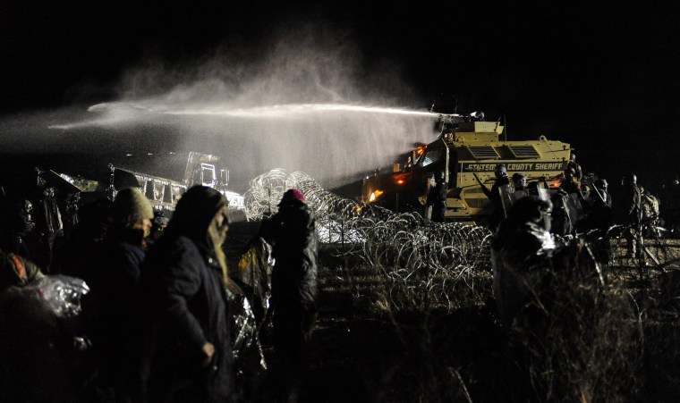 Image: Police use a water cannon on protesters during a protest against plans to pass the Dakota Access pipeline near the Standing Rock Indian Reservation, near Cannon Ball, North Dakota, U.S.