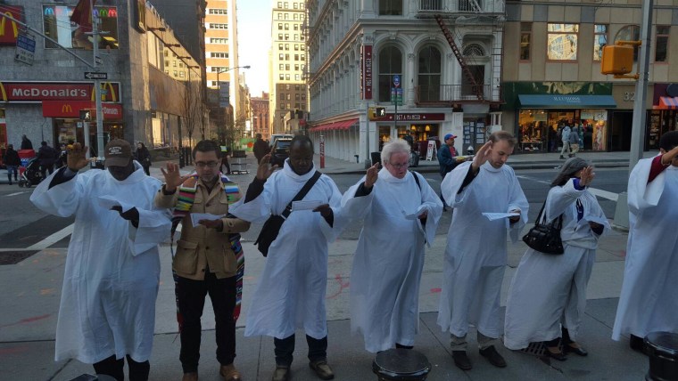 Interfaith leaders participate in the Jericho Walk around immigration services building in Federal Plaza.