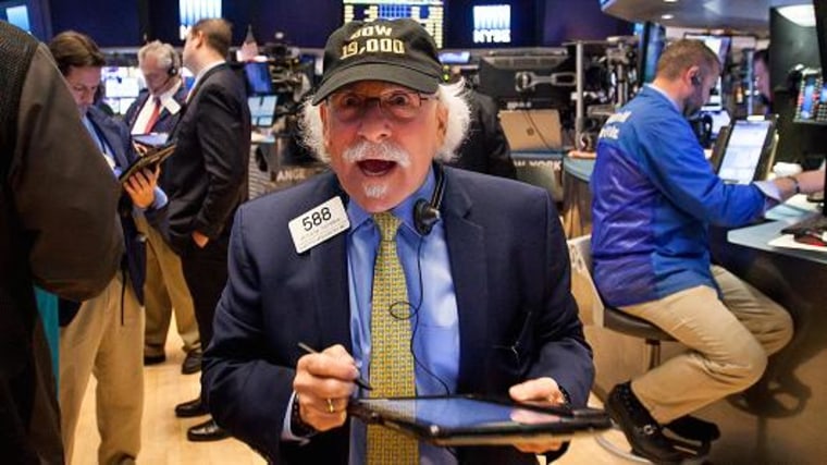 A trader wears a hat that reads 'DOW 19,000' on the floor of the New York Stock Exchange (NYSE) in New York, U.S., on Monday, Nov. 21, 2016.