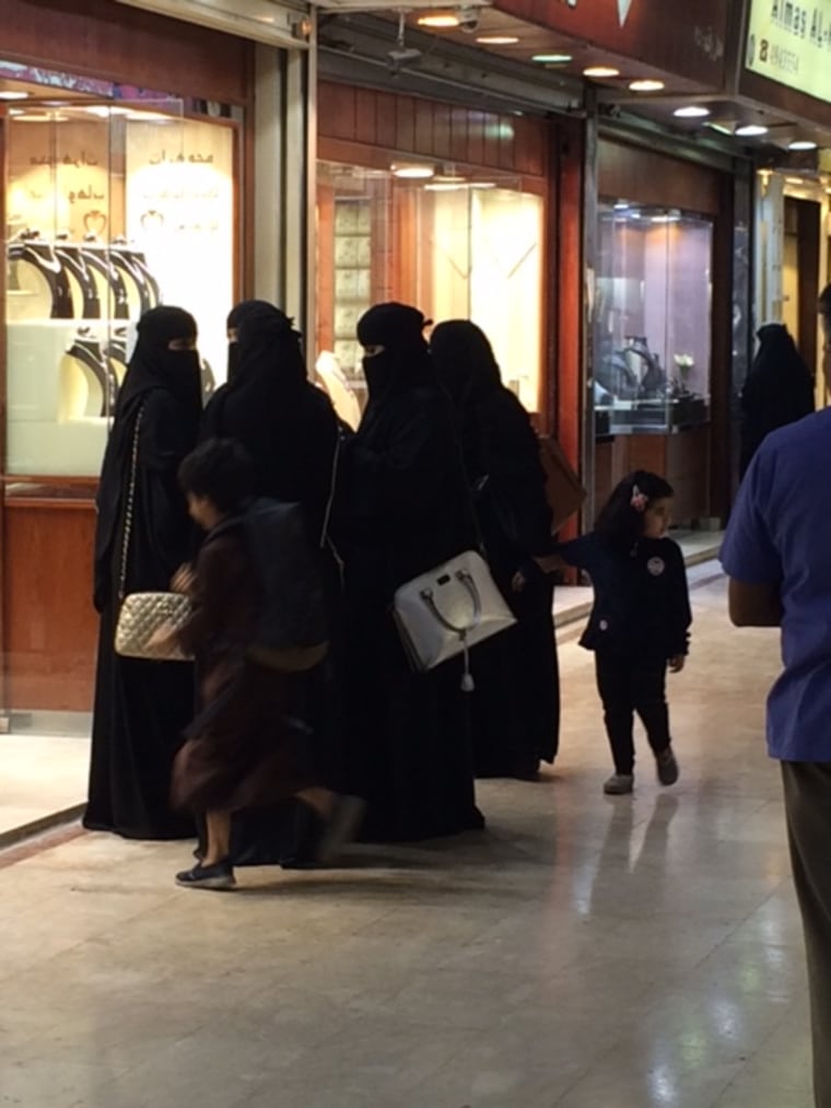 Image: Women walk in Riyadh's Kuwaiti Souk