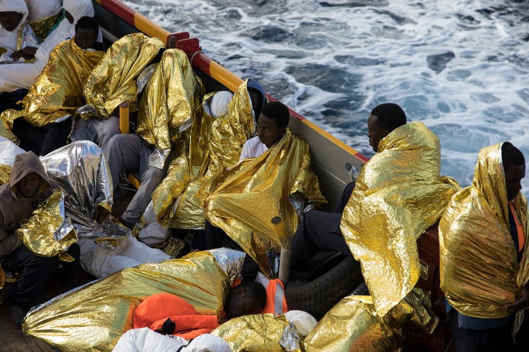 Image: Some of more than 600 people rescued off Italy