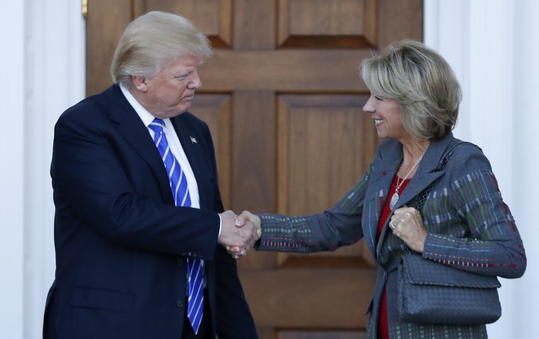 Image: Donald Trump, Betsy DeVos