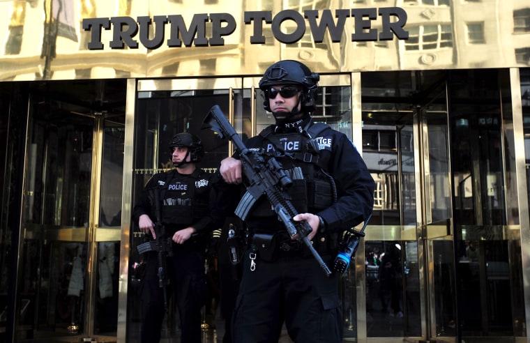 Image: New York Police Department (NYPD) officers guard the main entrance of the Trump Tower