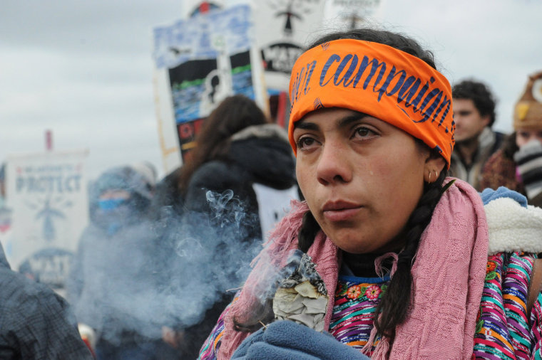 Image: A protester cries while watching a demonstration on Turtle Island on Thanksgiving day during a protest against plans to pass the Dakota Access pipeline near the Standing Rock Indian Reservation, near Cannon Ball, North Dakota, U.S.
