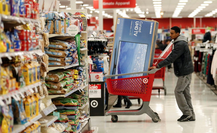 Image: Customer pushes his shopping cart during the Black Friday sales event on Thanksgiving Day at Target in Chicago