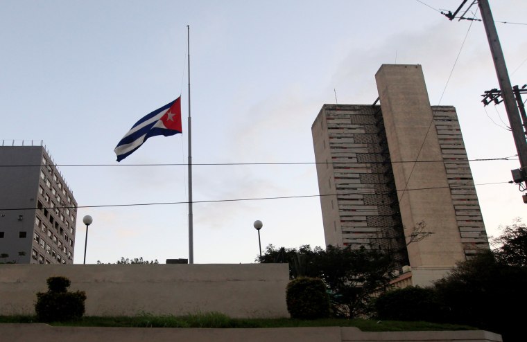 Image: The Cuban flag flies at half mast after the death of Cuba's former President Fidel Castro was announced in Havana