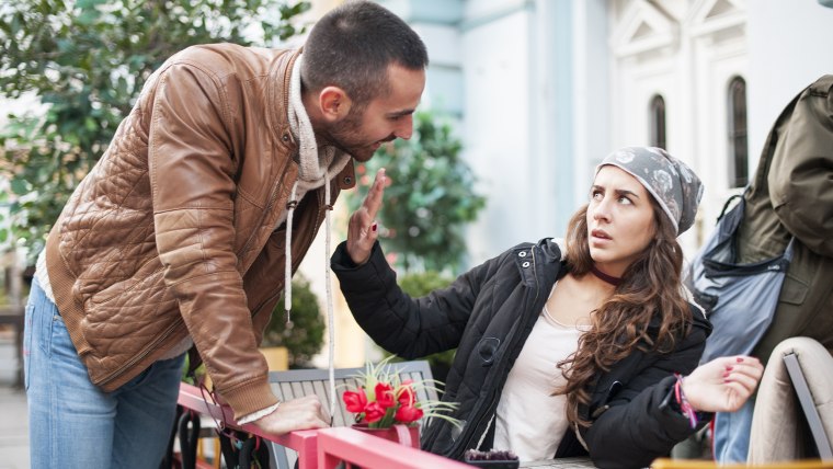 Man bothering woman at cafe