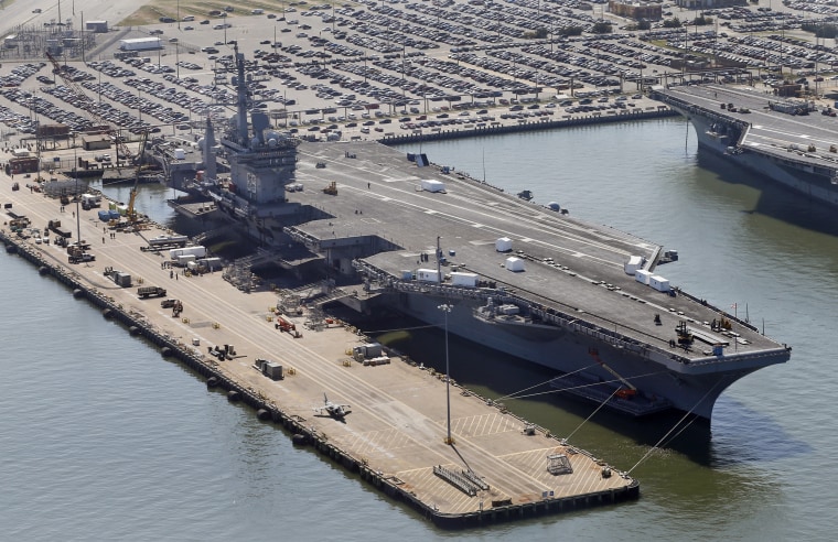 The nuclear powered aircraft carrier USS Dwight D. Eisenhower sits pier side at Naval Station Norfolk in Norfolk, Virginia,  April 27.