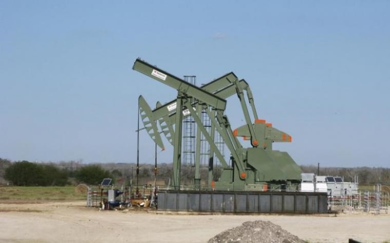 A pump jack used to help lift crude oil from a well in South Texas' Eagle Ford Shale formation stands idle in Dewitt County Texas