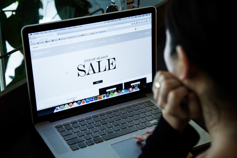Image: A woman online shopping at online fashion retailer Reebonz
