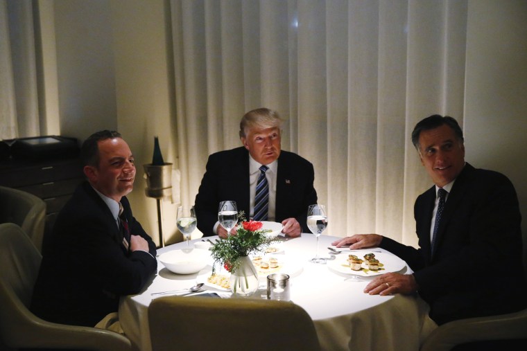 Image: U.S. President-elect Trump sits at a table for dinner with former Massachusetts Governor Romney and his choice for White House Chief of Staff Priebus at Jean-Georges at the  Trump International Hotel &amp; Tower in New York