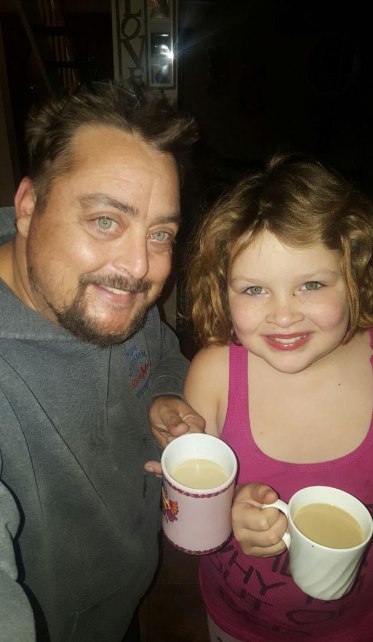 Image: Michael Reed with one of his daughters