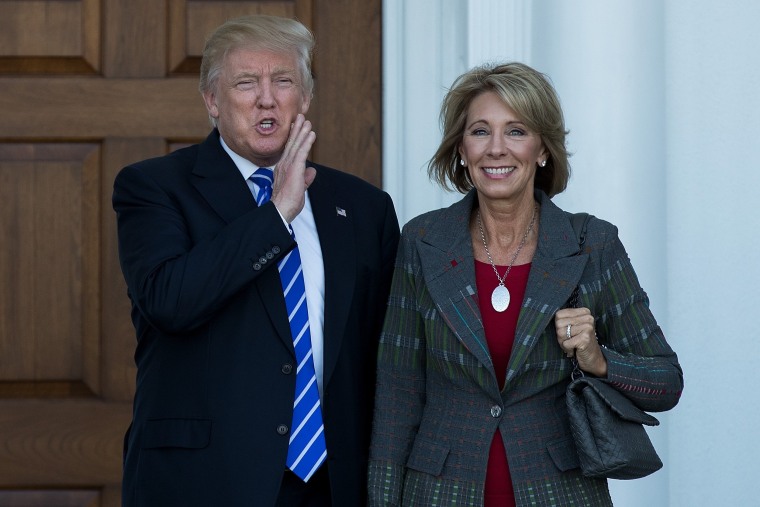 Image: Donald Trump and Betsy DeVos