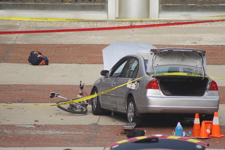 Image: A car which police say was used by an attacker to plow into a group of students is seen outside Watts Hall on Ohio State University's campus in Columbus