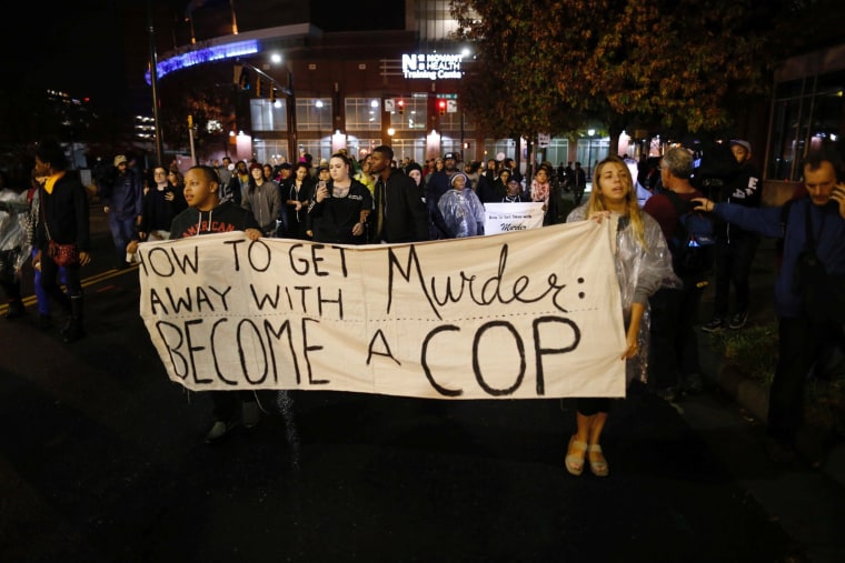 Image: Protesters march through uptown Charlotte, North Carolina November 30, 2016, following the decision of the district attorney not to press criminal charges against police in the shooting of Keith Scott.