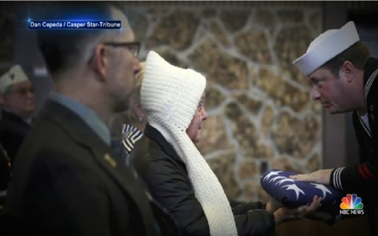 Reiman's sister, Diane, accepts American flag at her brother's funeral.