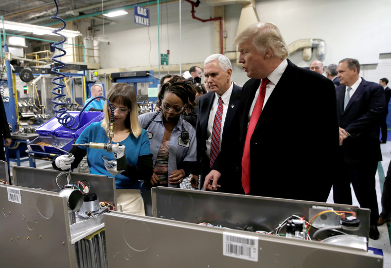 Image: U.S. President-elect Donald Trump tours a Carrier factory with Greg Hayes, CEO of United Technologies (L) in Indianapolis