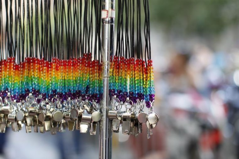 Rainbow whistles are shown hanging at the San Francisco Gay Pride Parade