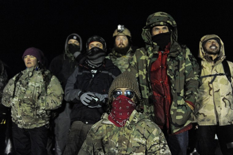 Image: Veterans have a demonstration on Backwater bridge during a protest against plans to pass the Dakota Access pipeline near the Standing Rock Indian Reservation, near Cannon Ball, North Dakota, U.S.