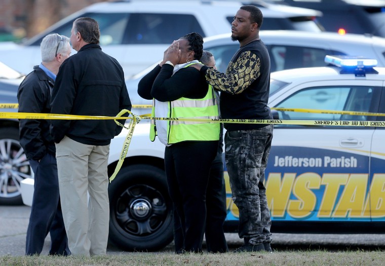 The victim's cousin Roxanne Lundy grieves  as the Jefferson Parish Sheriff's Office investigates the homicide of former NFL player Joe McKnight at Behrman Highway and Holmes Blvd. in Terrytown on Dec. 2.