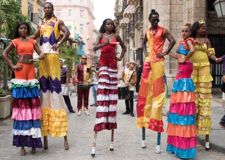 Street performers walk and dance their way through Habana Vieja (Old Havana)