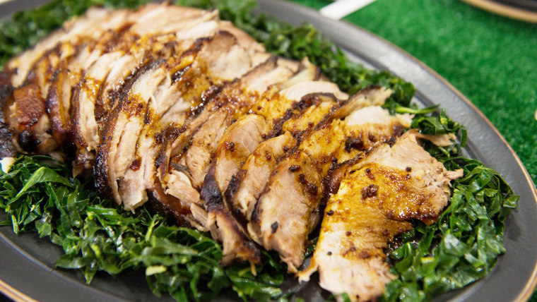 Feed a hungry crowd with easy orange pork roast and garlicky collard greens