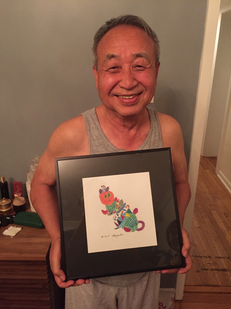 Chan Jae Lee shows off one of the original drawings he made for his grandchildren.