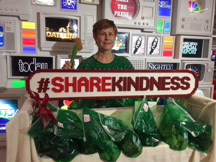 NBC employee George Ann Muller pushes her cart of homemade cookies.