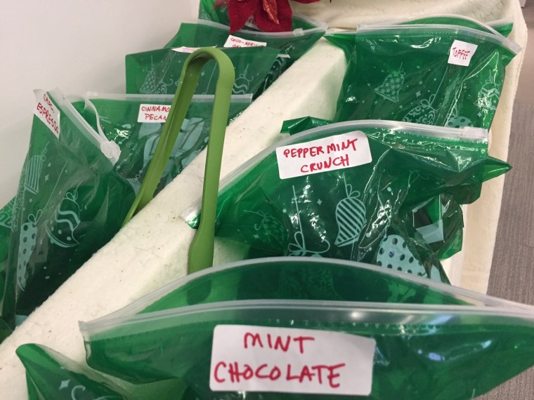Cookies are packed into festive green Ziploc bags.