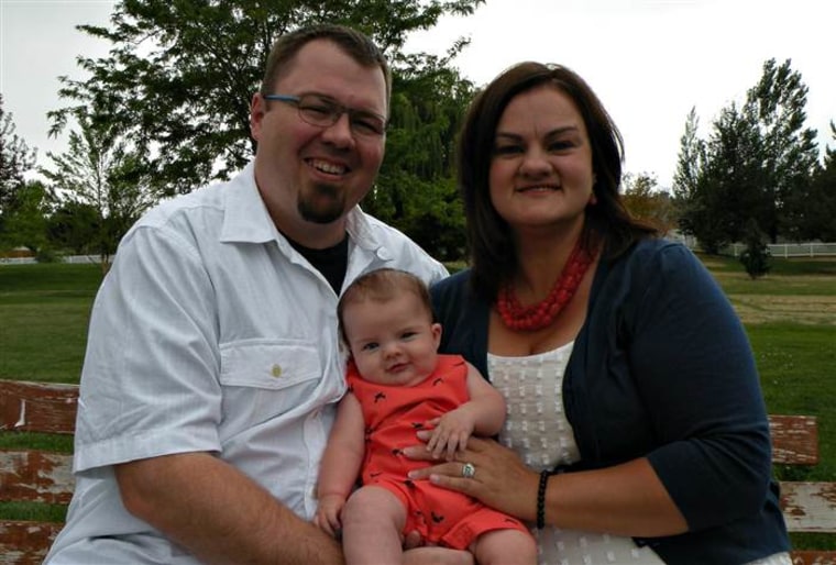 Amanda and Andrew Hanson hold their son Karson, who is now 4 months old.