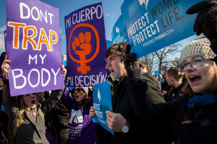 Image: Pro-choice advocates (left) and anti-abortion advocates (right) rally outside of the Supreme Court