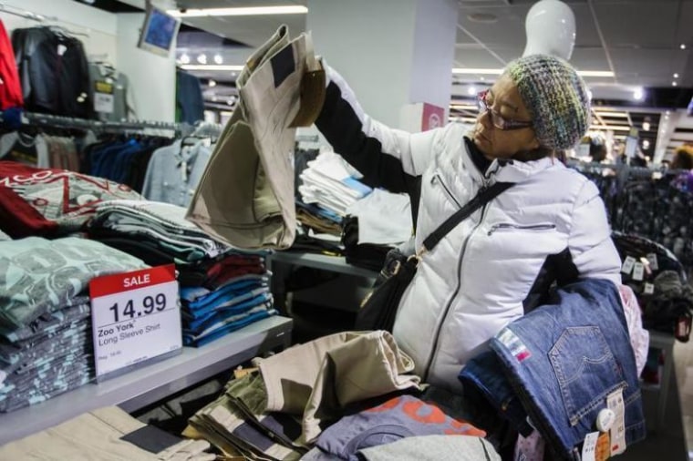 A shopper looks at items on sale inside of a JC Penney store during Black Friday sales in New York